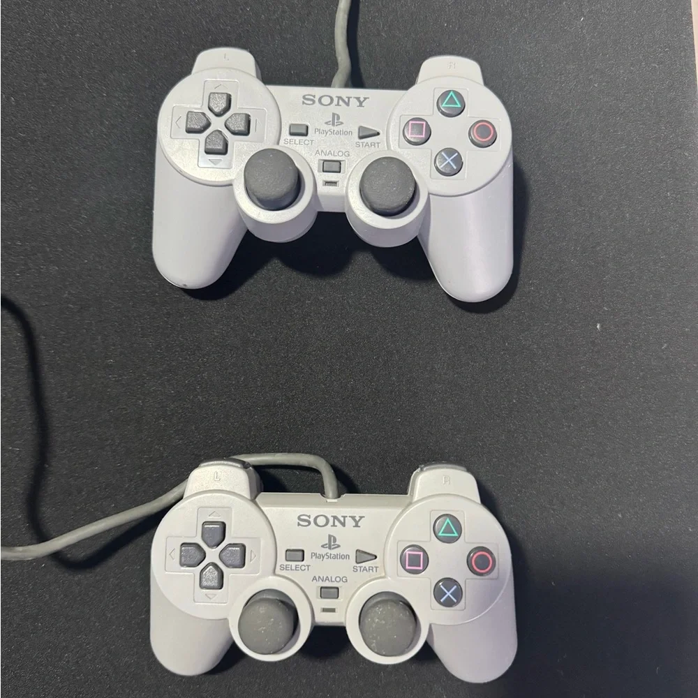 Sony PlayStation Console with Dual White Controllers